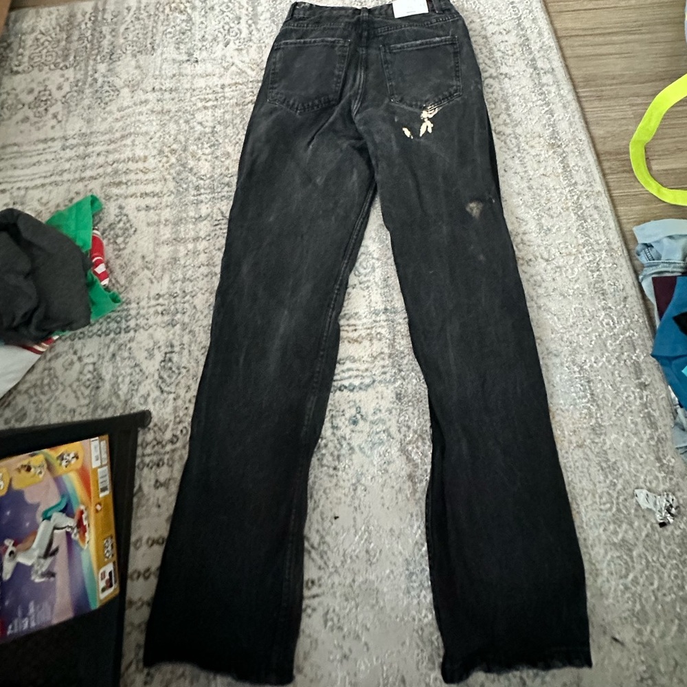 Black denim jeans with wide leg and high rise